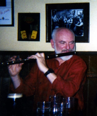 Matt Molloy playing flute in Westport in March 2000